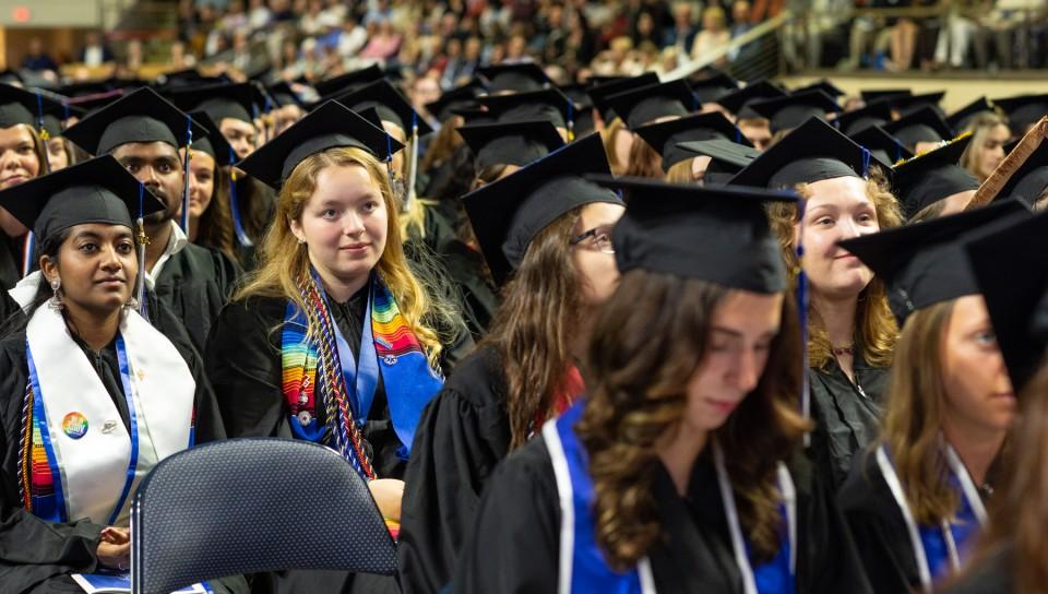 UNE graduates watch the ceremony from their seats