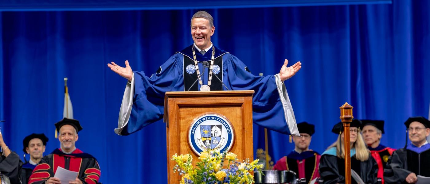 UNE President James Herbert speaks at the podium